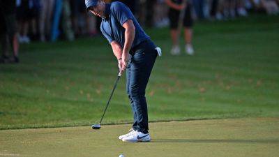 Rory McIlroy survives on the cut mark as darkness falls at Wentworth