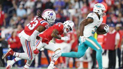 Dolphins outlast AFC East-rival Patriots behind Raheem Mostert's stellar night