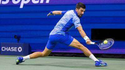 Djokovic fights back from two sets down to reach US Open final 16