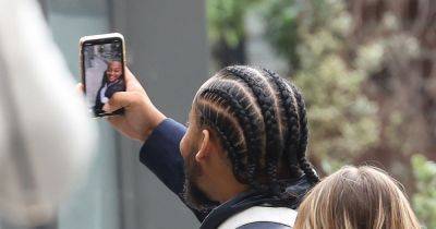 Grinning thug poses for selfies outside court after he's spared jail for stabbing stranger in Piccadilly Gardens