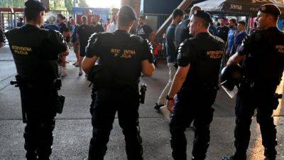 Croatian police detain 9 soccer fans over violence in Greece that killed 1 last month