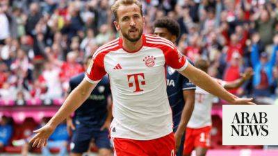Record-setting Kane hits hat-trick as Bayern rout Bochum