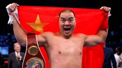 Oleksandr Usyk - Joe Joyce - Zhang knocks out Joyce in round three of heavyweight rematch - channelnewsasia.com - Britain - Ukraine - China