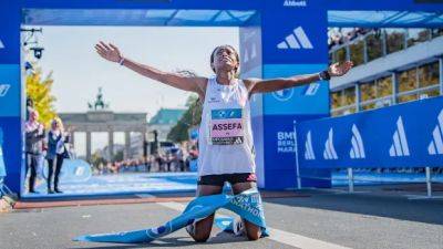 Tigist Assefa shatters women's marathon world record by more than 2 minutes in Berlin
