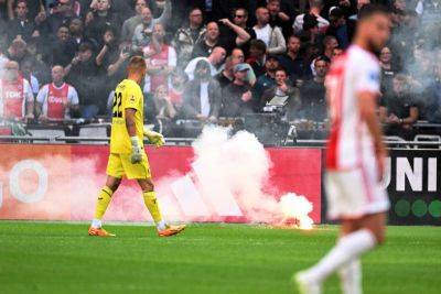 Ajax v Feyenoord: KNVB orders abandoned match to resume on Wednesday with no fans - thenationalnews.com - Netherlands