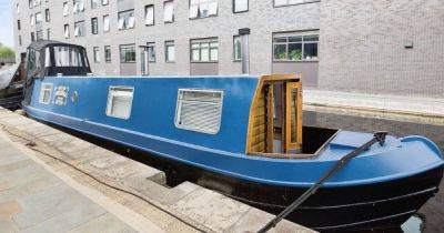 Inside the bargain narrowboat set on trendy Manchester marina that's FAR cheaper to live on than land