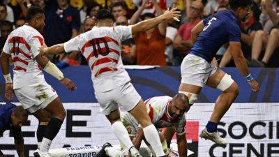 Japan boost knockout hopes by holding off 14-man Samoa