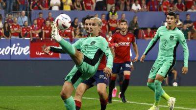 Antoine Griezmann - David García - Atletico hang on to beat Osasuna 2-0 in ill-tempered match - channelnewsasia.com - Spain