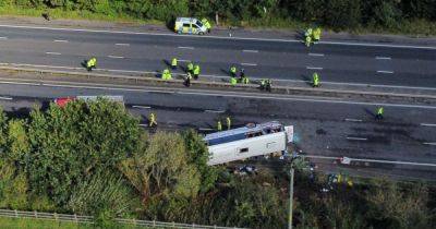 M53 closure LIVE after school bus crashes with '50 hurt' and major incident declared