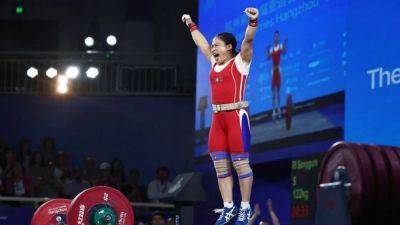 Games-North Korea's Ri, Kang set weightlifting world records at Asian Games