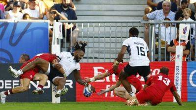 Fiji dig deep to beat Georgia and close on last eight