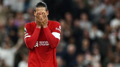 Spurs pip nine-man Liverpool with injury-time own goal