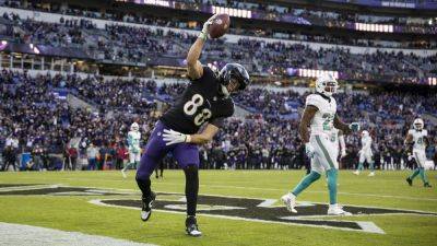 Baltimore clinch AFC North title with Miami mauling