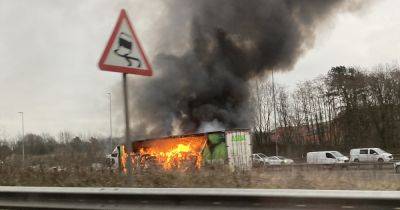 LIVE M60 blocked after Asda lorry catches fire - traffic updates