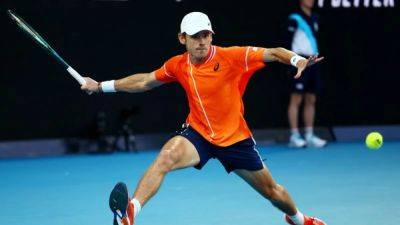 Alex De-Minaur - De Minaur advances to round two after Raonic retirement - channelnewsasia.com - Italy - Australia - county Walton