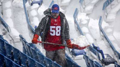 Field at Bills' stadium clear, but snow still covers stands - ESPN