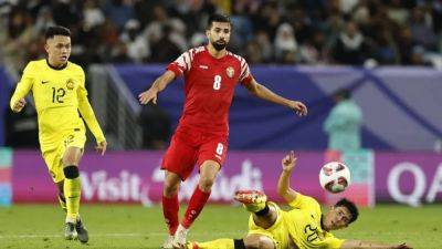 Jordan, Iraq claim wins at Asian Cup as Malaysia and Indonesia fall - channelnewsasia.com - Japan - Indonesia - Bahrain - Jordan - South Korea - Malaysia - Iraq