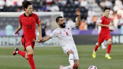 Son fluffs lines but S.Korea, Iraq win openers at Asian Cup
