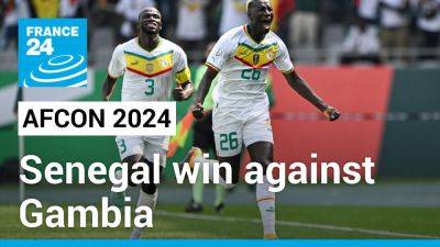 AFCON 2024: Holders Senegal begin title defence with 3-0 victory over Gambia - france24.com - France - Senegal - Gambia - Ivory Coast