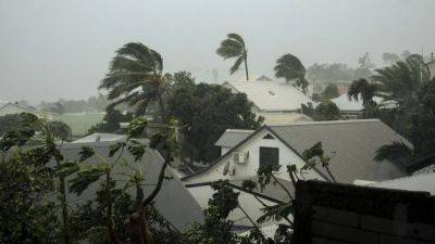 Cars submerged as Cyclone Belal sparks flash flooding in Mauritius