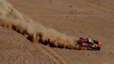 Rallying-Loeb takes another chunk of time out of Sainz's Dakar lead