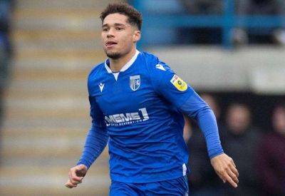 Striker Lewis Walker has left Gillingham to sign an 18-month contract at National League side Woking