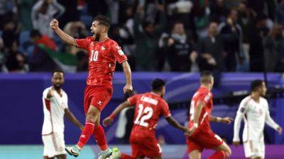 Palestine and 10-man UAE play out draw in Asian Cup