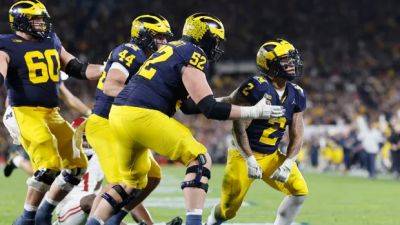 Michigan wins OT thriller over Alabama to reach college football national championship