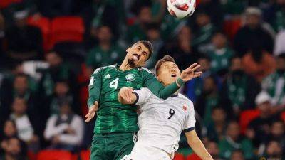 Saudi Arabia beat nine-man Kyrgyzstan to move into Asian Cup knockouts