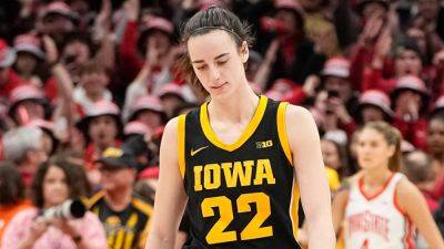 Iowa's Caitlin Clark shaken up after colliding with court-storming fan: 'Just hammered'