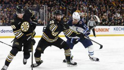 Streaking Bruins pull away for victory over Jets