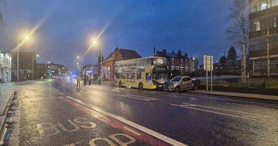 Driver suffers potentially serious injuries in crash with double-decker bus