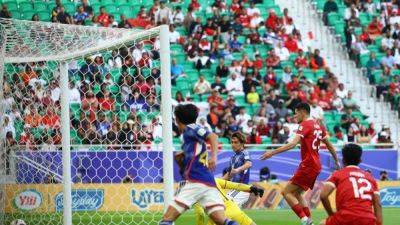 Jordi Amat - Japan beat Indonesia to seal Asian Cup last-16 spot, Iraq top group - channelnewsasia.com - Japan - Indonesia - Vietnam - Iraq