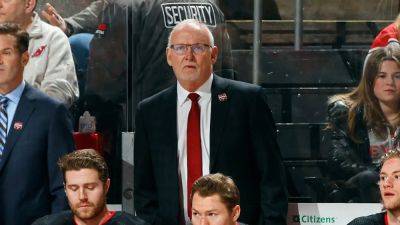 Devils coach leaves game early after taking puck to head on bench
