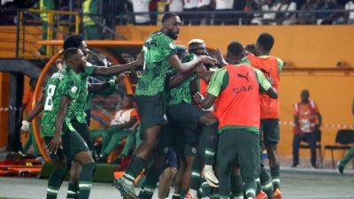 Alex Iwobi - Calvin Bassey - Ola Aina - Lookman double puts Nigeria into Cup of Nations quarter-finals - channelnewsasia.com - Namibia - Cameroon - Nigeria - Angola