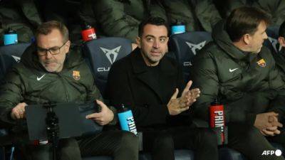 Xavi says will quit Barca after Villarreal defeat, Madrid take Liga lead