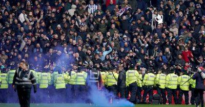 Violent scenes break out at Black Country derby as game halted with West Brom facing FA punishment