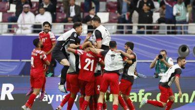 Jordan leave it late to beat Iraq 3-2 and reach Asian Cup quarter-finals - channelnewsasia.com - Jordan - Iraq - Tajikistan