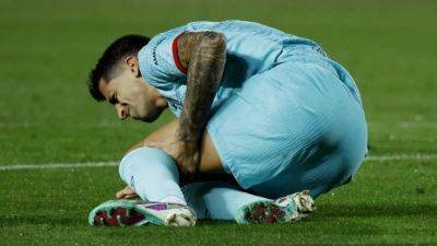Barca defender Cancelo sidelined with knee injury