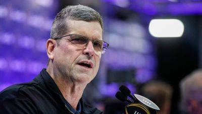 Michigan's Jim Harbaugh evades questions about possible leap to NFL before title game against Washington