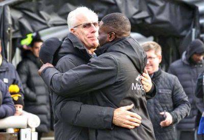Wolves legends embrace on the pitch as Mick McCarthy sees George Elokobi lead Maidstone United to FA Cup victory over Stevenage