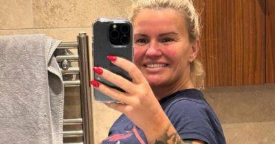 Kerry Katona's all smiles as she poses in thong to show off incredible weight loss as she's told 'don't care'