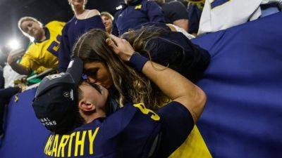 J.J.Maccarthy - Michigan's JJ McCarthy shares smooch with girlfriend after winning national championship - foxnews.com - Usa - Washington - state Michigan - state Illinois