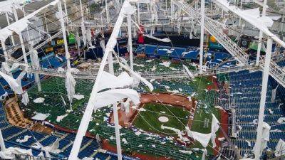 Ron Desantis - Hurricane Milton tears roof off domed home of MLB's Tampa Bay Rays and litters field - cbc.ca - county Bay
