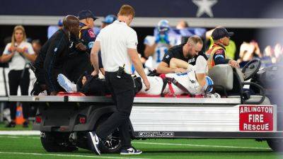 Lions edge rusher Aidan Hutchinson carted off with broken tibia - ESPN