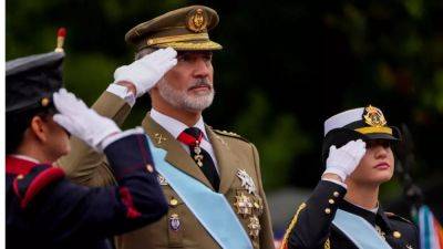 Despite stormy skies, Spain's National Day celebrations are still a spectacle