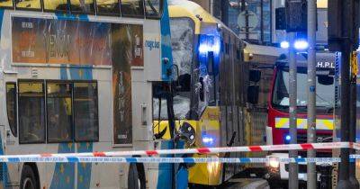 'I thought it was a bomb': City centre brought to a standstill as four injured in head-on crash between tram and bus