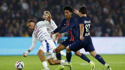 PSG beat Strasbourg 4-2 to claim top spot