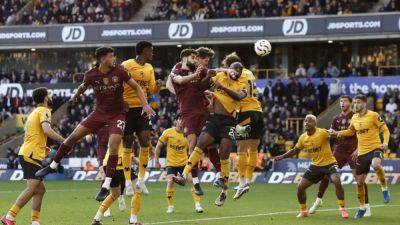 Stones late show earns Man City win at Wolves