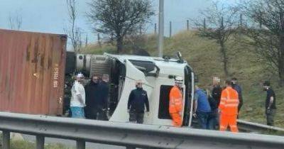 LIVE: A56 blocked after lorry smashes into central reservation and overturns - updates - manchestereveningnews.co.uk